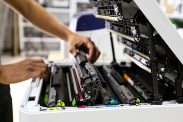 Technician hand open cover printer photocopier or photocopy to replace ink cartridges or fix paper...