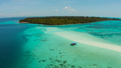 Fototapeta na wymiar Travel concept: sandy beach on a tropical island by coral reef atoll from above. Mansalangan sandbar, Balabac, Palawan, Philippines. Summer and travel vacation concept