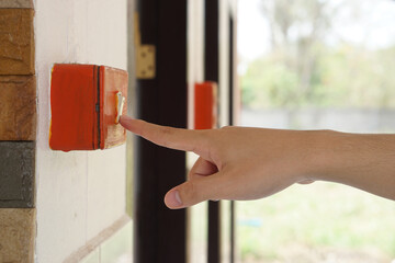 Closeup hand is press electric switch to switch off the light after using. Concept, campaign to...