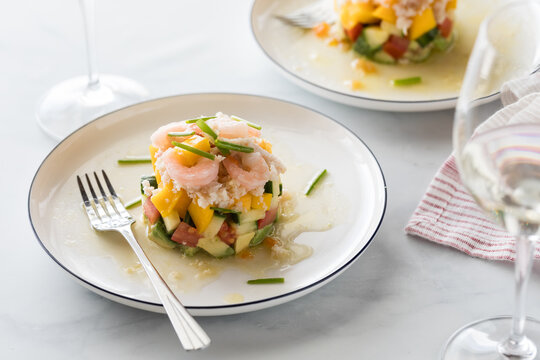 Crab And Shrimp Stack Salad Made With Mango, Cucumber And Avocado.