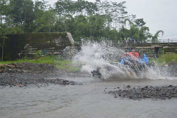 Yogyakarta, Indonesia - 12 Decembre 2021 : Offroad car rides, jeep cars, Merapi Yogjakarta Indonesia lava tour, one of the famous rides in Indonesia