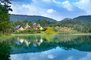 Naklejka premium beautiful pictures of the three villas in Binh An resort reflecting on Tuyen Lam Lake