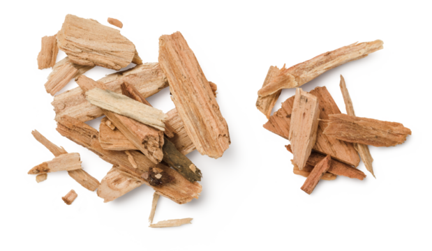 closeup of two piles of cedar or palo santo incense, wood chips isolated over a transparent background, top view / flat lay