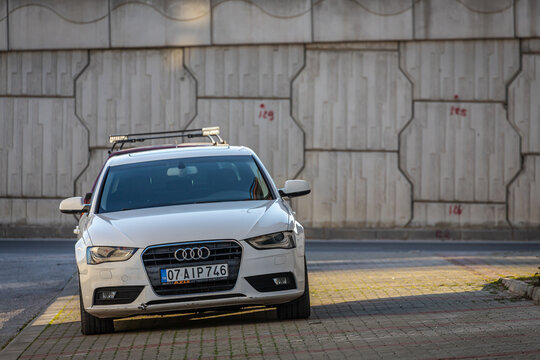 Side, Turkey – February 13 2023:     white  Audi A4    is parked  on the street on a warm  day
