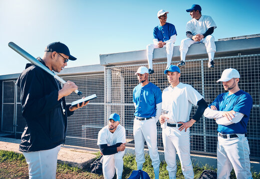 Sports, baseball and coach talking to the team on the field before a game, workout or training. Fitness, discussion and trainer planning a strategy with a male sport group before a match or practice. - Powered by Adobe