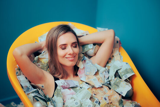 Rich Carefree Woman Bathing in a Tub of Money. Young person achieving financial independence and stability accumulating savings
