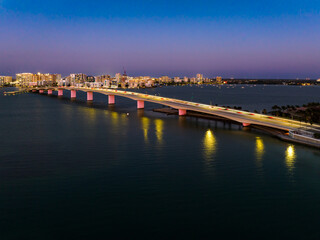 Fototapeta na wymiar Evening aerial image of the Sarasota, Florida Skyline and Bridge Across Sarasota Bay