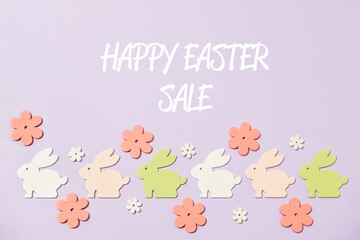 easter sale text on paper background with easter bunnies and flowers