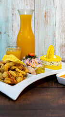 ceviche, chicharrón de pescado and causa de atún con maracuyá. peruvian food