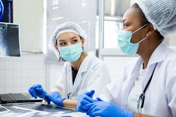 group of medical student study in class room. medical students studying human brain disease diagnosis through learning from X-ray film. Learn about brain surgery for diagnosis.