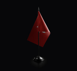 Small national flag of the Hong Kong on a black background