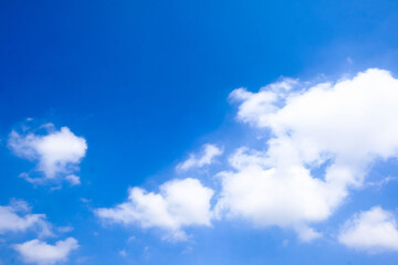 Beautiful blue sky with white fluffy clouds.