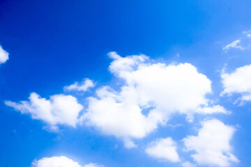 Beautiful blue sky with white fluffy clouds.