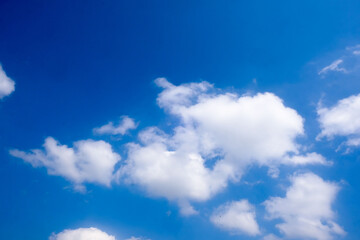 Beautiful blue sky with white fluffy clouds.
