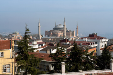 Fototapeta na wymiar View of the Hagia Sophia Grand Mosque from the roof of a house on a sunny day, Istanbul, Turkey