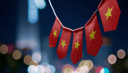 A garland of Vietnam national flags on an abstract blurred background