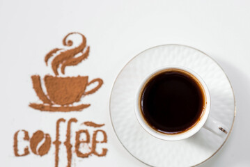 Hot drinks. The inscription "Coffee", and a cup of coffee or tea is made of ground coffee on a white isolated background. Banner.