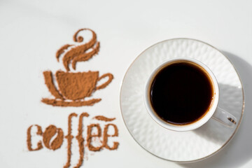 Hot drinks. The inscription "Coffee", and a cup of coffee or tea is made of ground coffee on a white isolated background. Banner.
