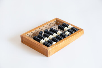 Old wooden abacus for counting money on a white background