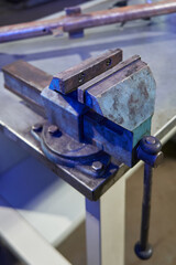 clamping bends are separated on a large metal cast-iron bench vise