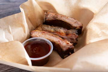 A view of a basket order of three baby back ribs.