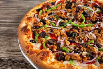 A view of a supreme pizza.