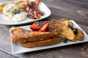 A view of French toast, along with a breakfast plate.