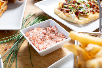 A view of a condiment cup of Himalayan pink rock salt.