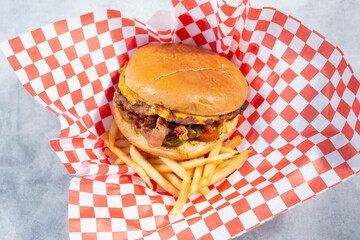 A top down view of a jalapeno bacon cheeseburger.