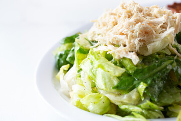 A closeup view of a shredded chicken salad.