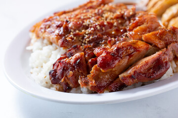 A closeup view of a chicken teriyaki plate.