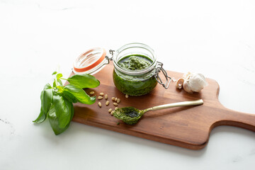 A view of a jar of pesto.