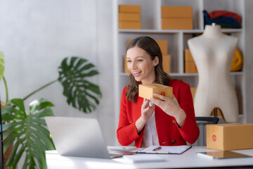 Business owner prepare boxed product to send to customer and have online video calls with them.