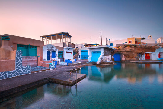 Boat houses in the harbour of Mandrakia village on the northern coast