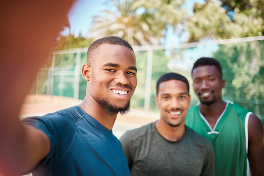 Sports, selfie and smile with friends on basketball court for teamwork, social media and training. Fitness, workout and collaboration with portrait of basketball player for exercise, happy and summer
