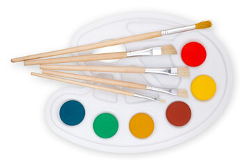 Color palette with paint brushes, top view isolated on a white background, concept of color shop or...
