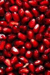 pomegranate seeds on the dark background