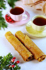 Homemade apple pastille. Apple pastille. Healthy food without sugar.The pastille is rolled into a tube. Vertical photo.