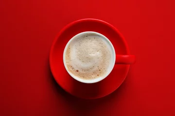 Foto op Plexiglas Cup with aromatic cappuccino on red background, top view © New Africa