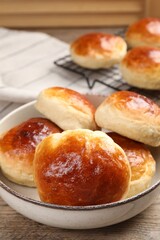 Tasty scones prepared on soda water on wooden table