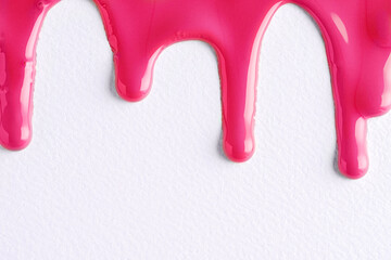 Dark pink liquid drops of paint color flow down on white canvas. Abstract art. Red paint dripping on the white wall with copy space.