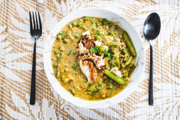 plant-based green curry with mixed vegetables and fried silken tofu