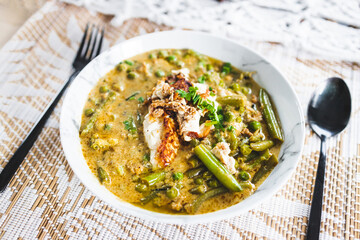 plant-based green curry with mixed vegetables and fried silken tofu