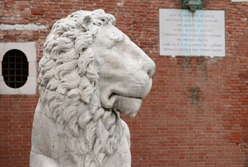 The head of a marble lion at the main entrance to the Venetian Arsenal. Italy