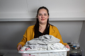 woman with a pile of laundry