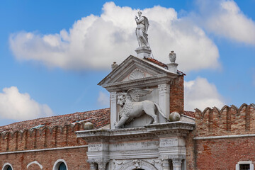 Fototapeta na wymiar Richly decorated portico over the main entrance to the Venetian Arsenal