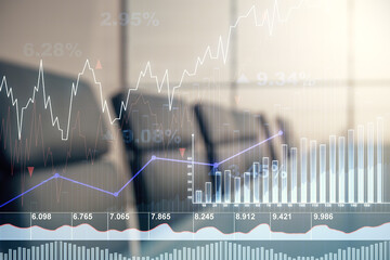 Multi exposure of virtual abstract financial graph interface on a modern coworking room background,...
