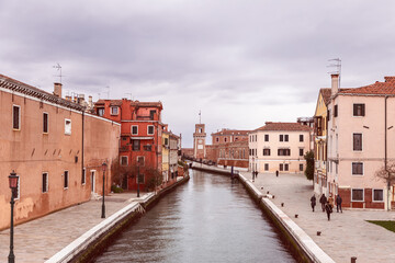 Canal of Venice leading to the Venetian arsenal (vintage style photo)