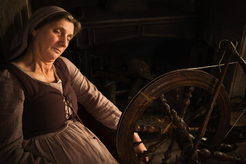Tired woman with spinning wheel
