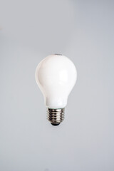 An energy-saving light bulb in the hand of man. Cheap energy. Green deal. Ecology